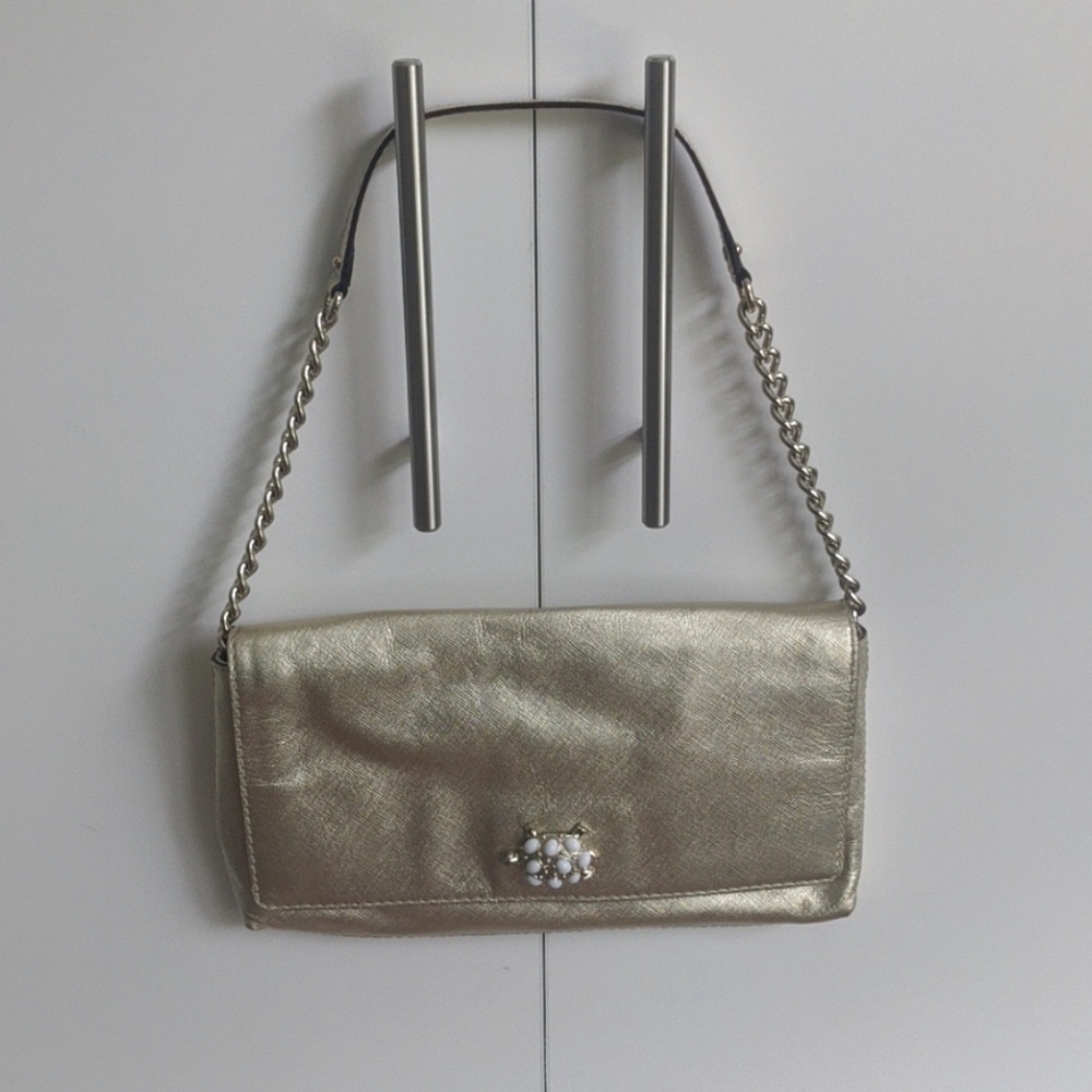 Gold Kate Spade turtle clasp bag
